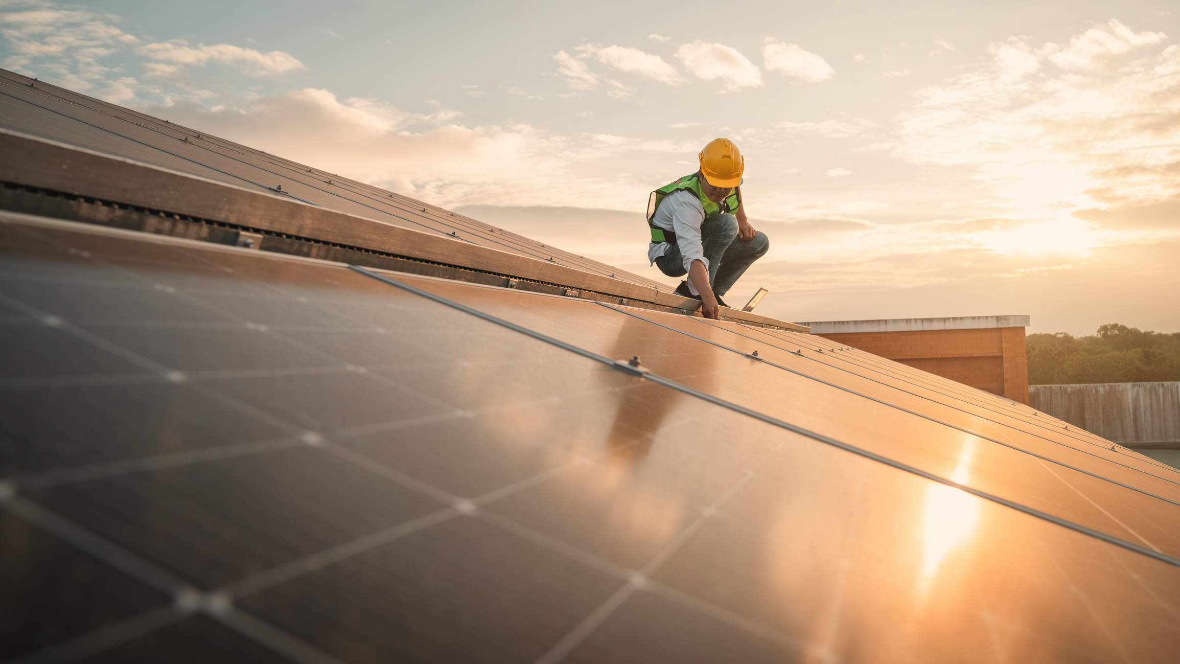 Service engineer checking solar cell on the roof for maintenance if there is a damaged part Engineer worker install solar panel Clean energy concept